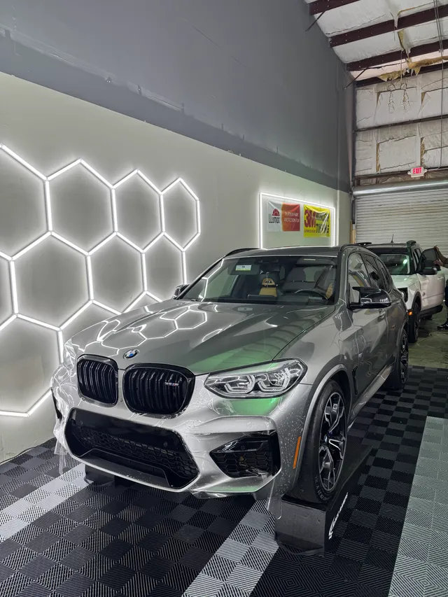 Silver BMW performance SUV having paint protection film fitted to the hood and front end in Alpharetta, GA
